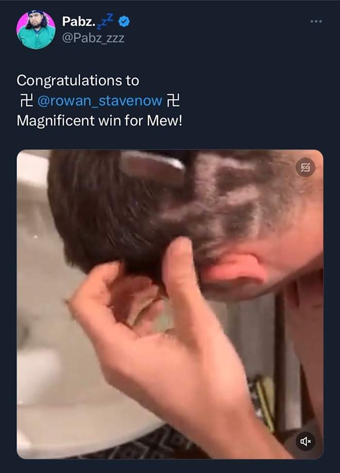 Winner at Pokemon regional with Swastika in hair